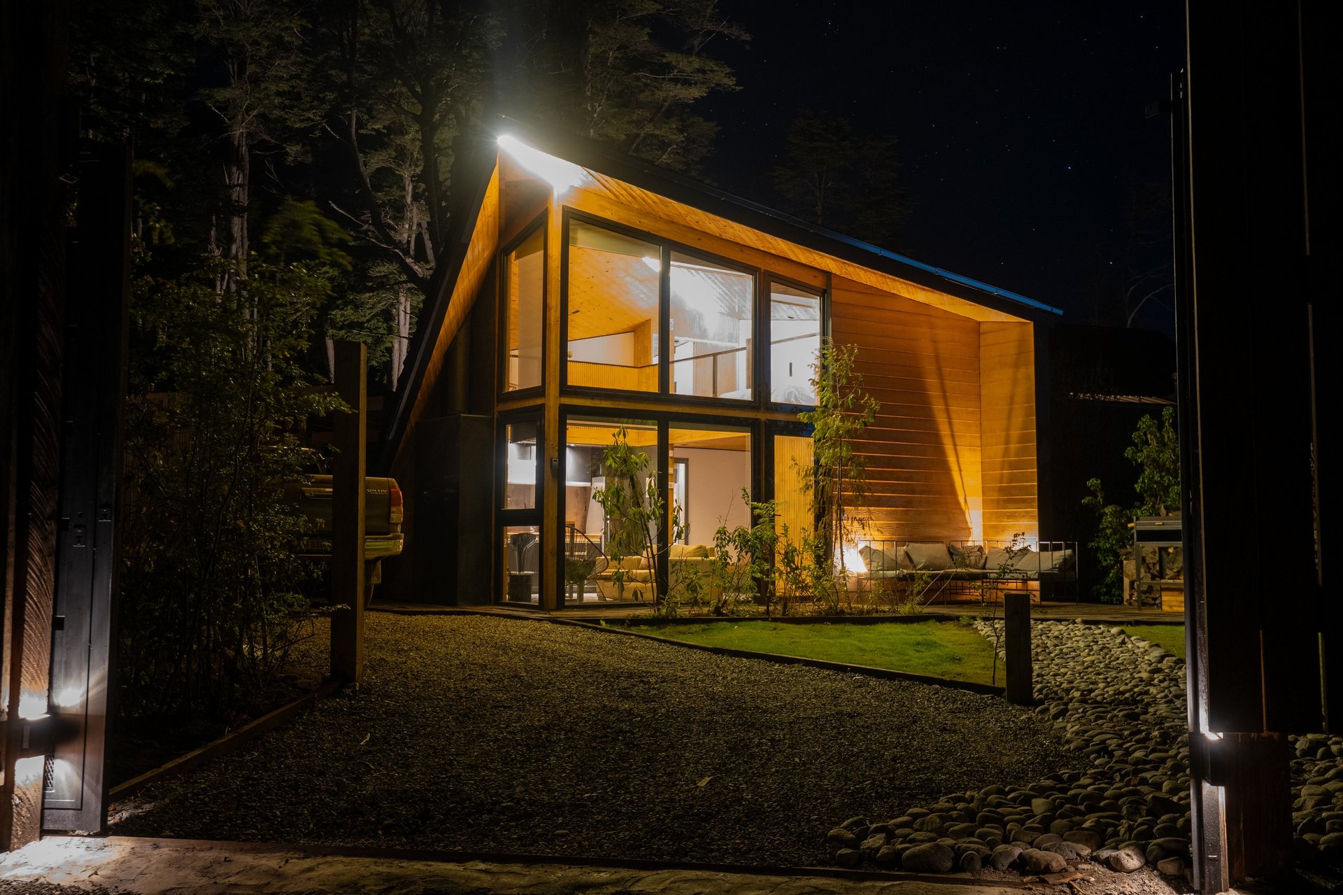 Modern luxury cabin illuminated at night